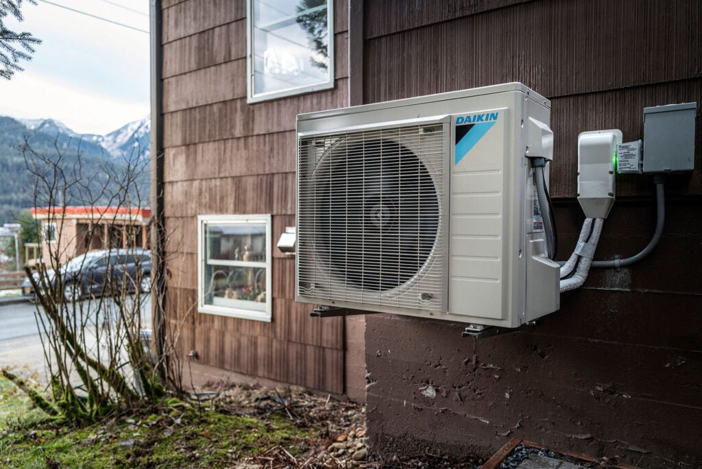 An outside unit to a heat pump system outside a home in Juneau, Alaska. (Michael Penn for Earthjustice)