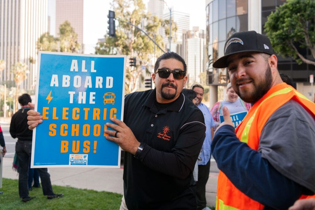 Supporters of electric zero-emission school buses take part in a rally outside the Los Angeles Unified School District headquarters on Nov. 15, 2022. The event was organized by the Los Angeles County Electric Truck and Bus Coalition.