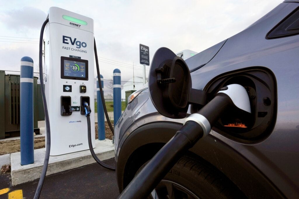 An electric vehicle charges at a fast charging station in Detroit on Nov. 16, 2022.