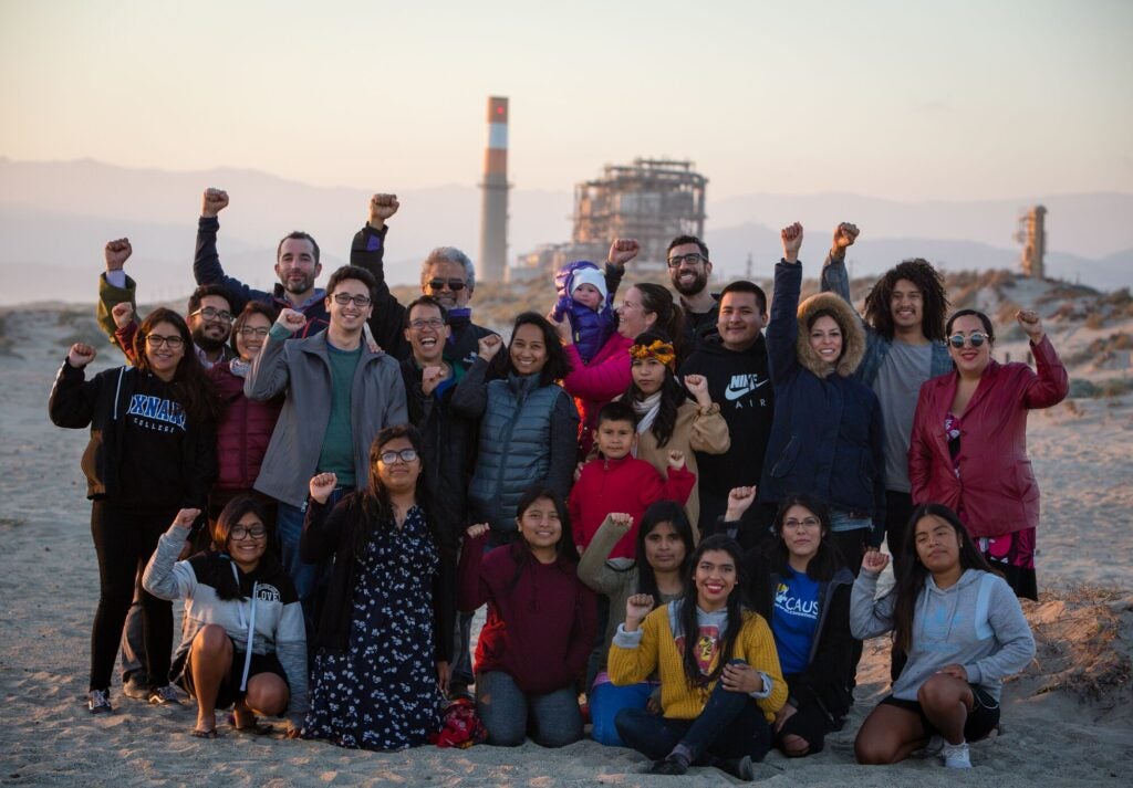 Oxnard resident celebrate in front of the Mandalay Generating Station in Oxnard, CA. The location was set to be the site of the Puente Power Station, a proposed natural gas power plant.