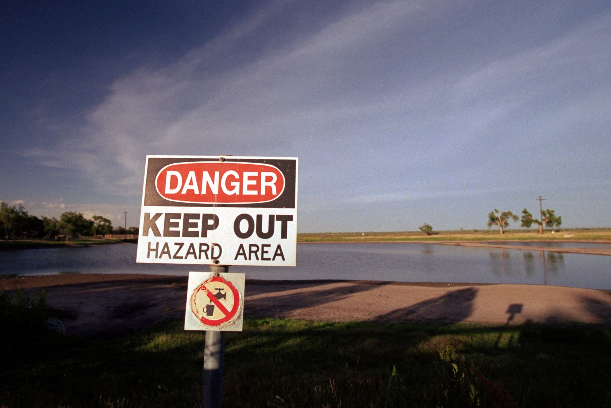 A warning sign posted near a pond contaminated with trichloroethylene and other hazardous chemicals at the former Reese Air Force Base near Lubbock, Texas.