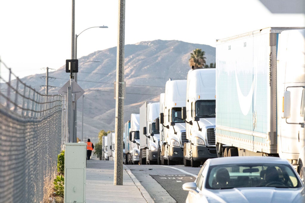 Freight trucks line up outside of a warehouse on Cyber Monday in San Bernardino. (Center for Community Action and Environmental Justice)