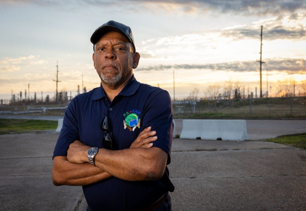 John Beard, Jr., stands a block away from where he grew up in Port Arthur, TX, where a petrochemical facility is located adjacent to a playground. Port Arthur is one of the most polluted communities in the country. (Chris Jordan-Bloch / Earthjustice)