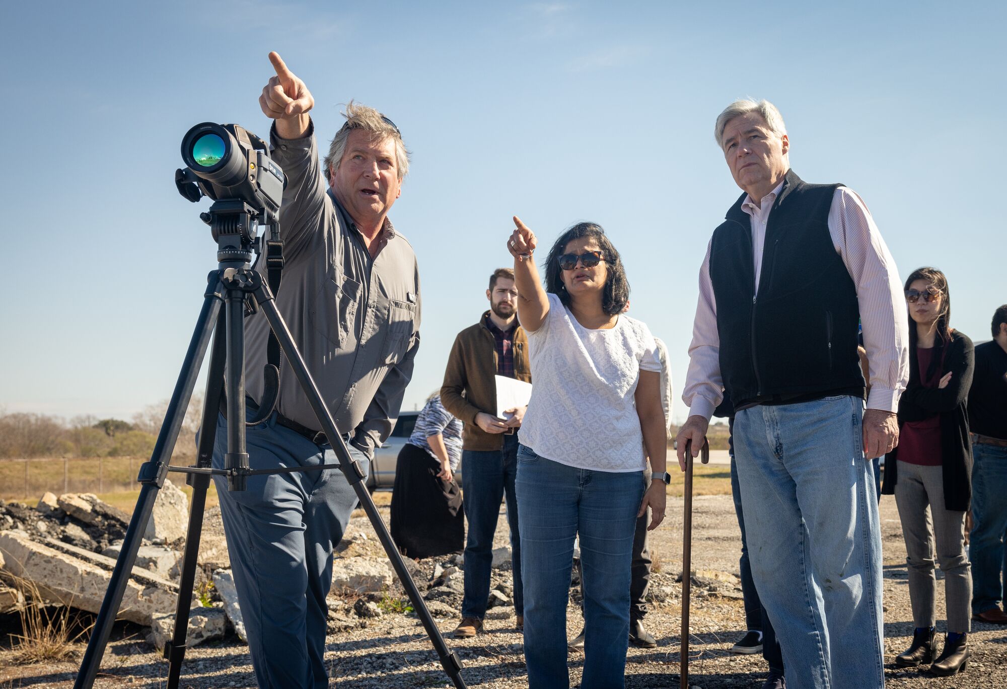 Sen. Sheldon Whitehouse (right) and Rep. Pramila Jayapal (center) use an optical gas imaging camera with infrared sensors to see fugitive gas leaks from industrial operations during a "Toxic Tour" of polluting facilities in Port Arthur, TX.