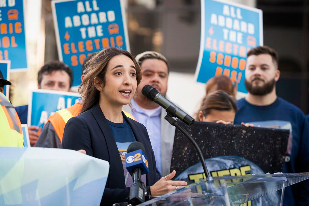 Earthjustice attorney Yasmine Agelidis speaks at a rally for electric school buses outside the Los Angeles Unified School District headquarters. The event was organized by the Los Angeles County Electric Truck and Bus Coalition. (Hannah Benet for Earthjustice)