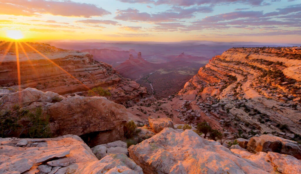 A wide southwest landscape with the sun just setting.