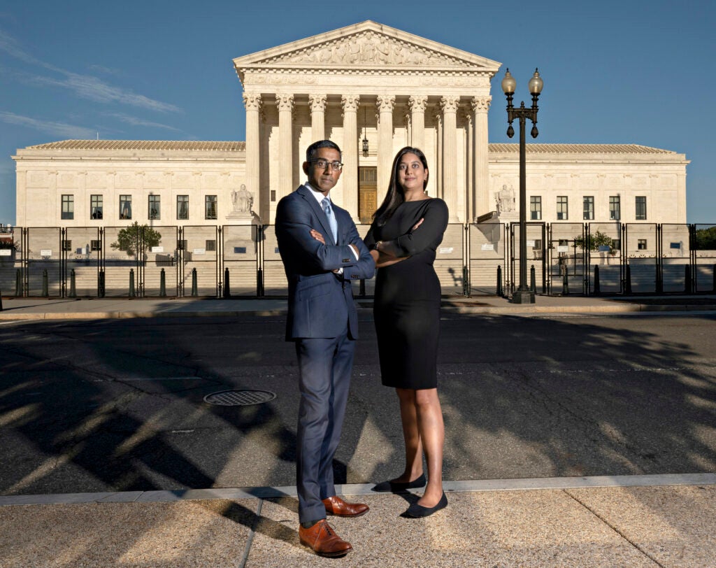 Earthjustice’s Senior Vice President of Programs, Sam Sankar, and Director of Strategic Legal Advocacy, Kirti Datla, pose for a portrait in front of the Supreme Court of the United States. (Melissa Lyttle for Earthjustice)