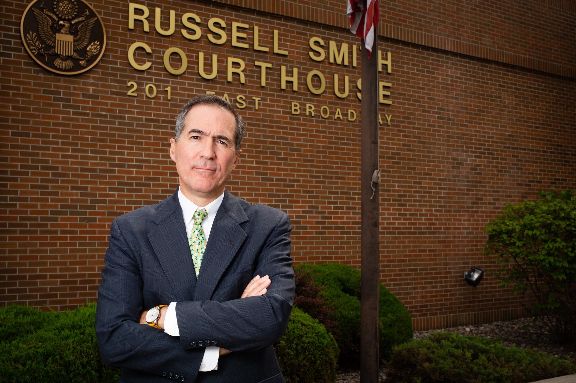 Earthjustice attorney Tim Preso standing with arms crossed, in front of the Russell Smith Courthouse in Missoula, Mont., on Aug 30, 2018.