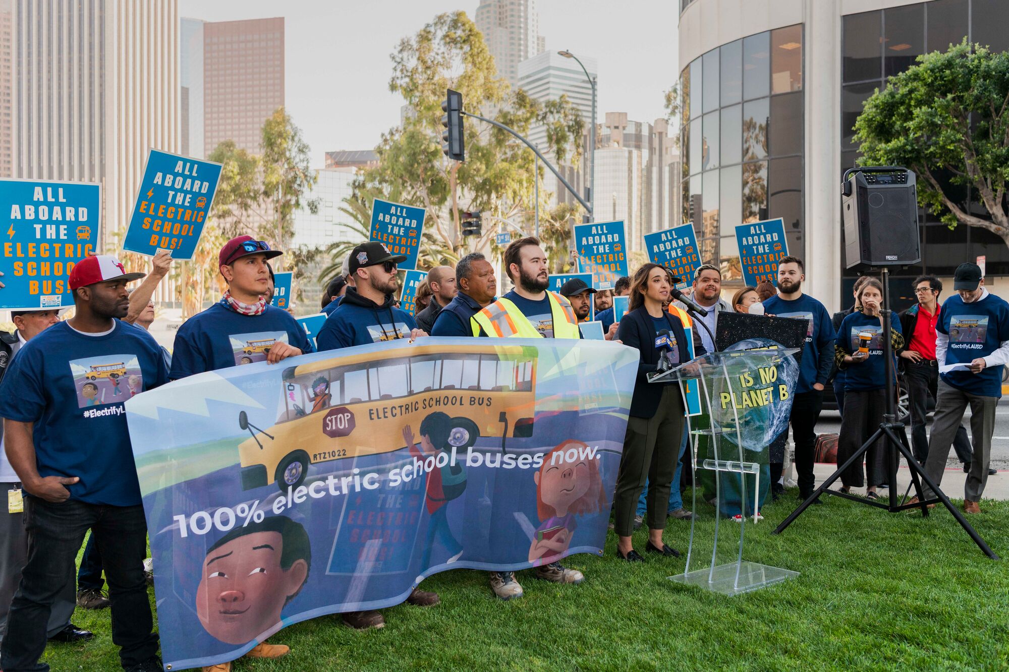 A coalition rallies for electric school buses outside the Los Angeles Unified School District headquarters.