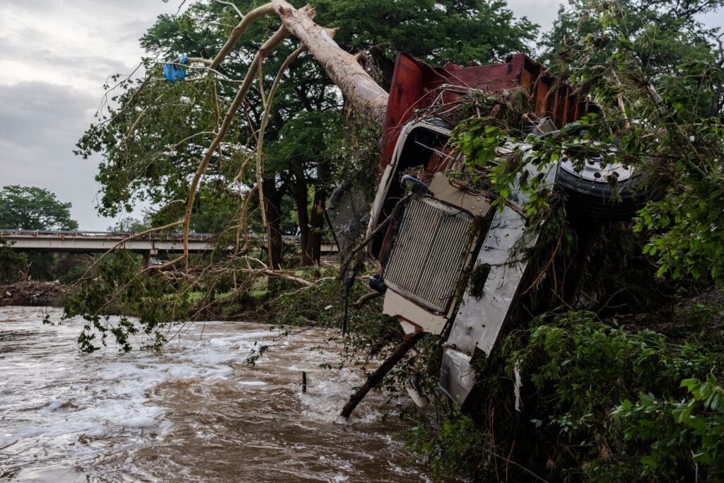 A large truck is impaled onto a tree after flash flooding on the bank Guadalupe River on July 5, 2025 in Center Point, Texas. Heavy rainfall caused flooding along the Guadalupe River in central Texas with multiple fatalities reported. (Photo by Jim Vondruska/Getty Images)