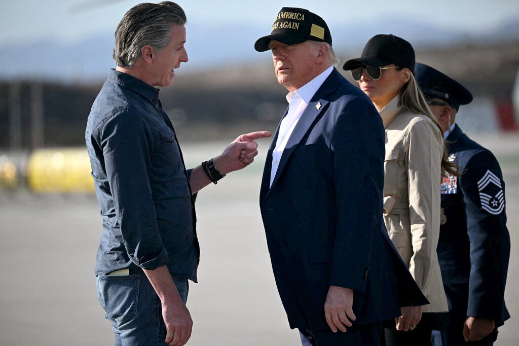 President Donald Trump and First Lady Melania Trump are greeted by California Governor Gavin Newsom upon arrival at Los Angeles International Airport in Los Angeles, California, on January 24, 2025, to visit the region devastated by the Palisades and Eaton fires. (Mandel Ngan / AFP via Getty Images) 
