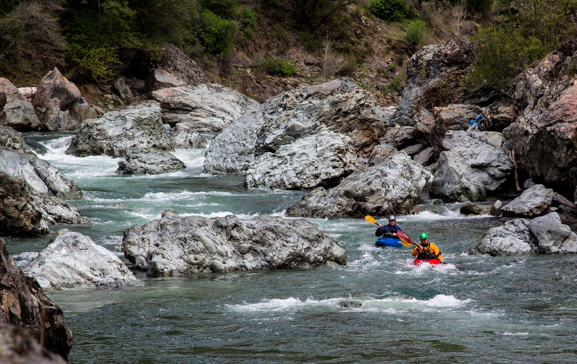 Kayakers traverse the famous Giant Gap run of the even more famous North Fork American River, one of the most challenging runs in Northern California.
