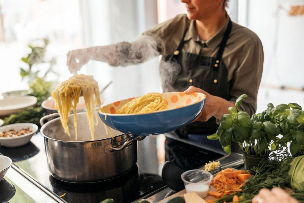 Electric appliances give a more comfortable quality of life in homes, with induction stoves offering quicker and more precise cooking. (Maskot / Getty Images)