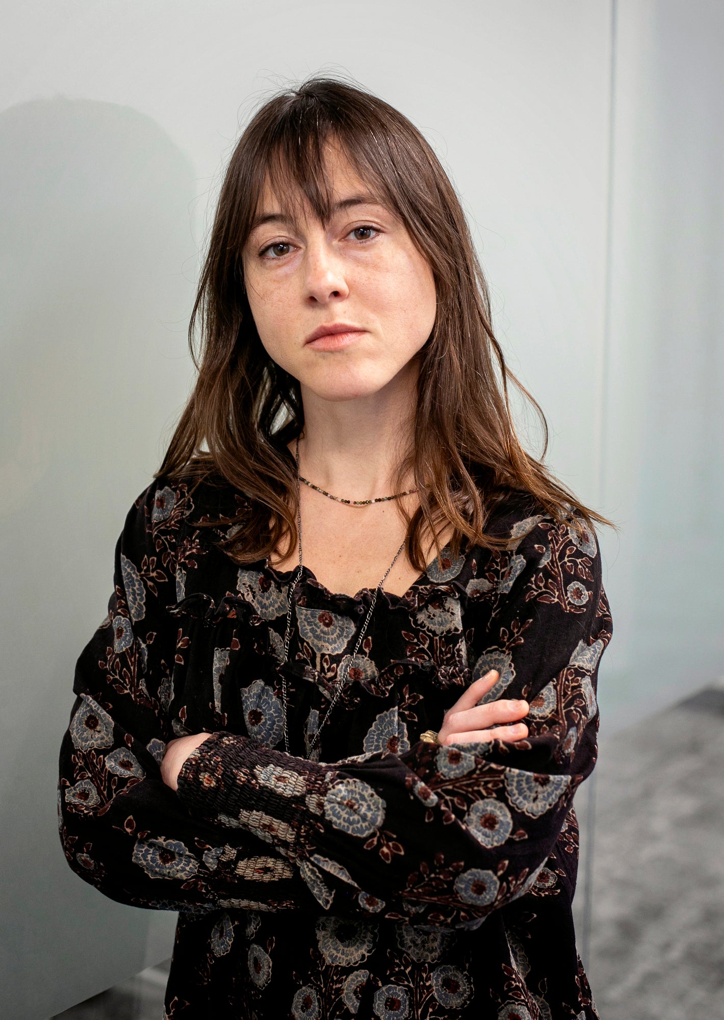 A woman looks directly into the camera for a portrait