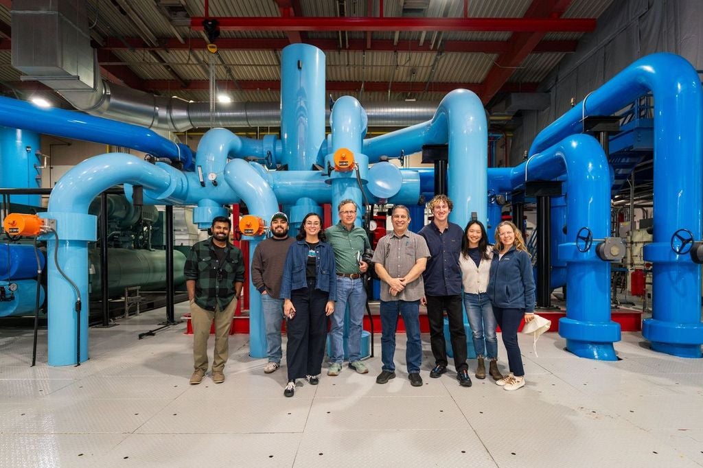 Coalition stands in front of industrial equipment at CSU Dominguez Hill's Central Plant