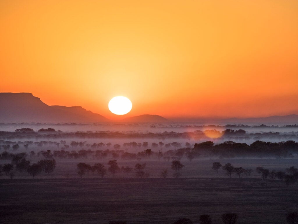 Bushfire smoke lies thick on the plain by the Ord River in Kimberley, Western Australia. (Steve Waters / Getty Images)