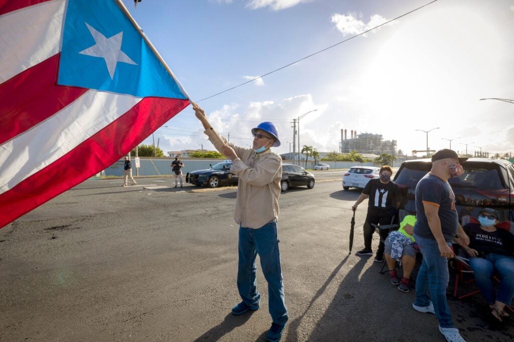 People protest against the public-private partnership between the public instrumentality and LUMA Energy in San Juan, Puerto Rico, in 2021. (Alejandro Granadillo / NurPhoto / Getty Images)