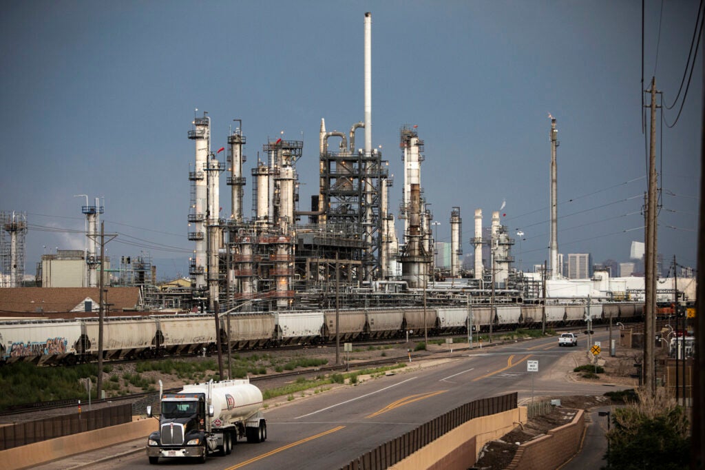 A refinery under a smoggy, gray sky.