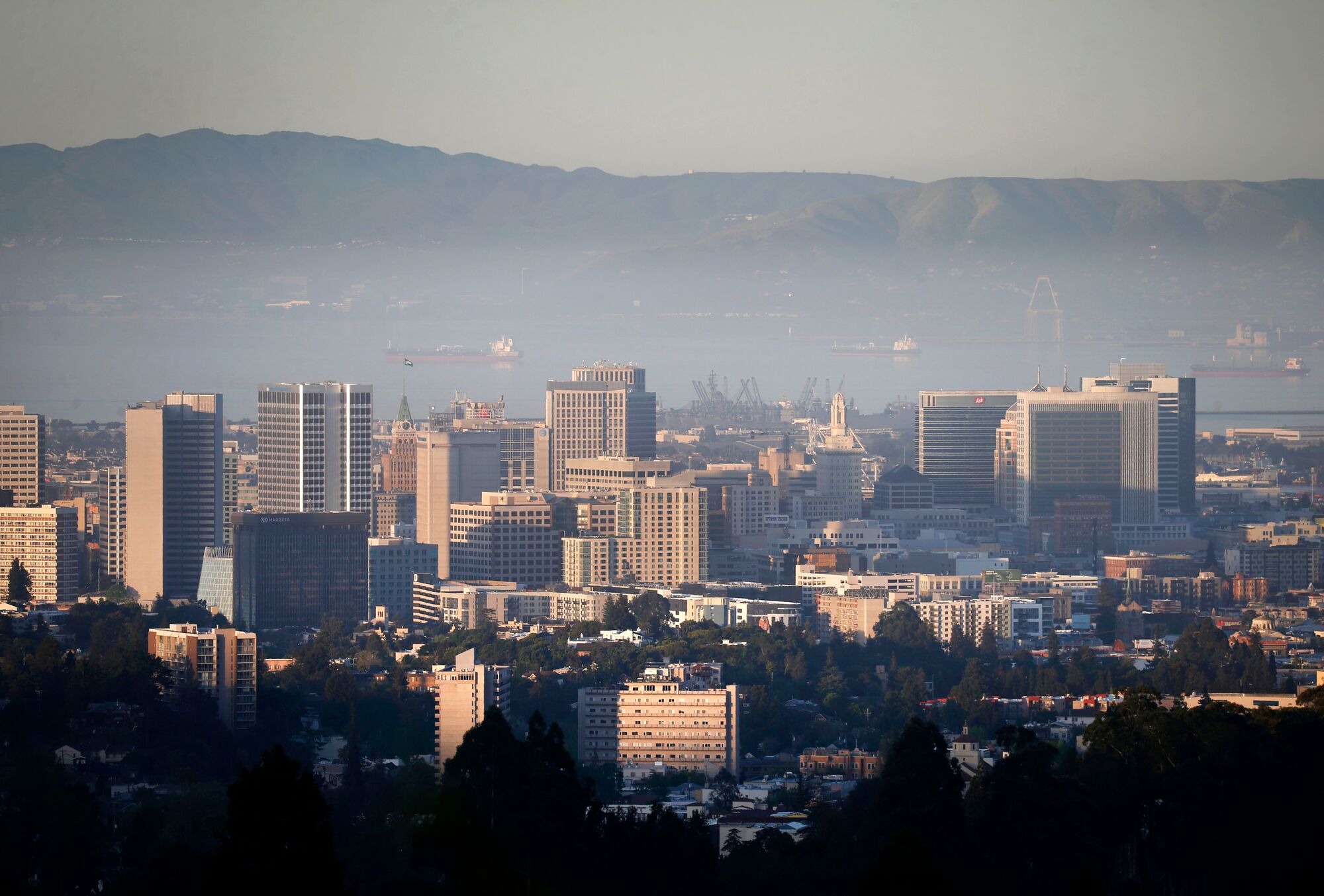 An inversion layer traps a low level of smog and particulates above Oakland, California on Tuesday, April 23, 2019.