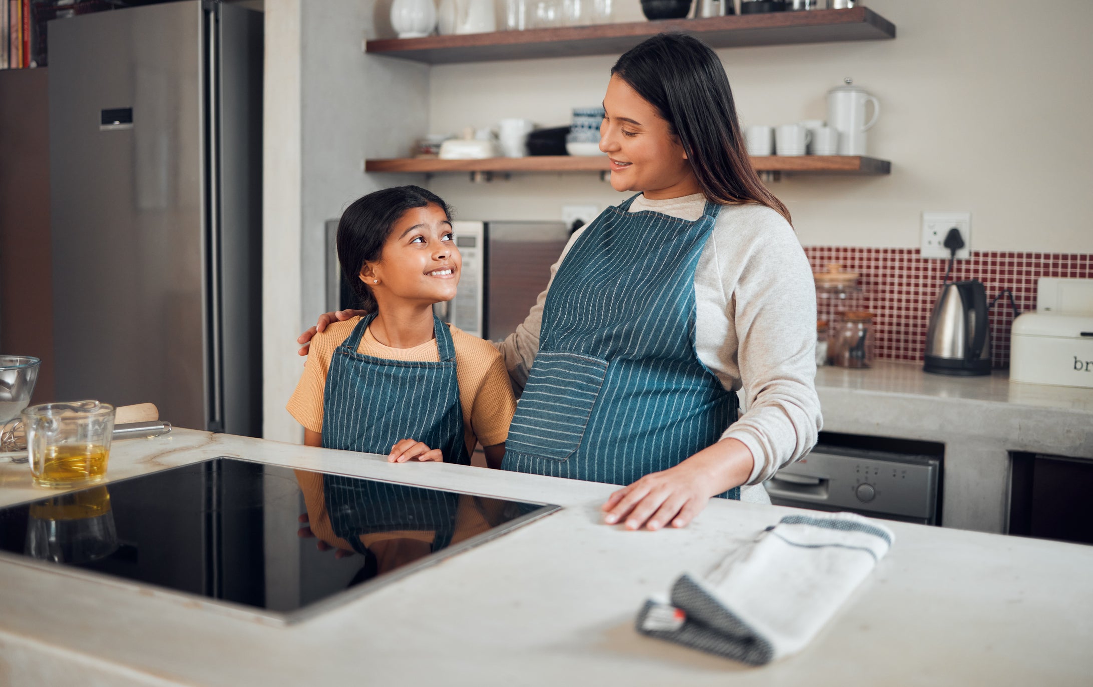 A family cooks on an induction stove (Getty Images)