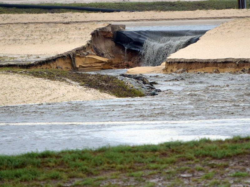 Toxic coal ash leaks from a breached pond at the L.V. Sutton Power Station outside Wilmington, North Carolina, following Hurricane Florence in Sept. 2018.
(Waterkeeper Alliance / CC BY-NC-ND 2.0)