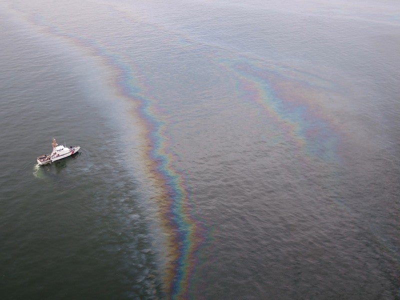 A boat monitors the oil sheen from the Taylor Energy leak.