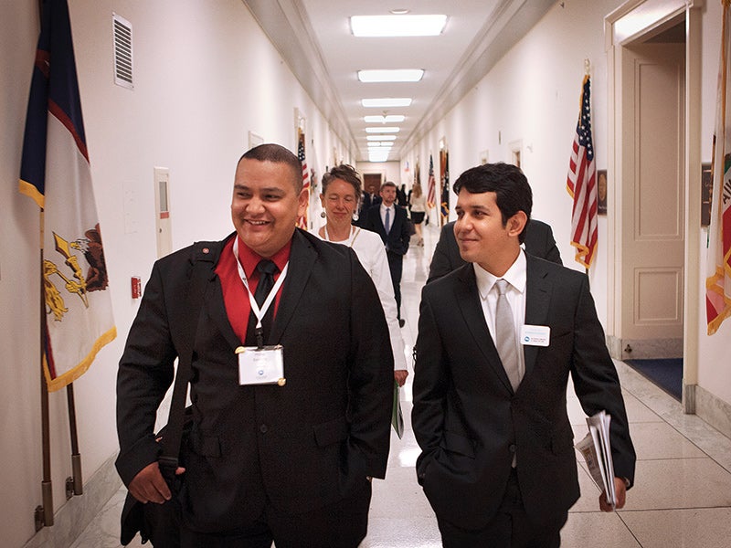 Clean Air Ambassadors Phillip Bautista and Eric Alfaro walk through the halls of Congress during the 50 States United event.