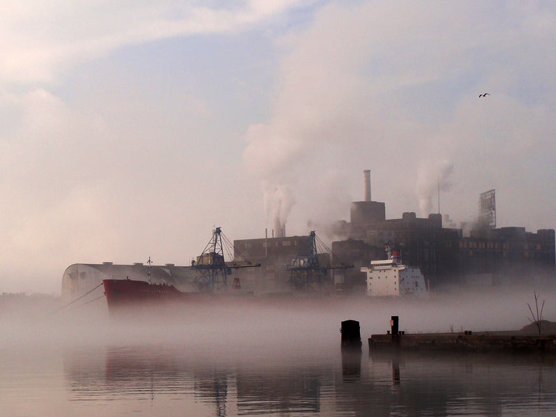 Fog and emissions from factories hang in the air in Baltimore, MD.
(oh_candy/Flickr)