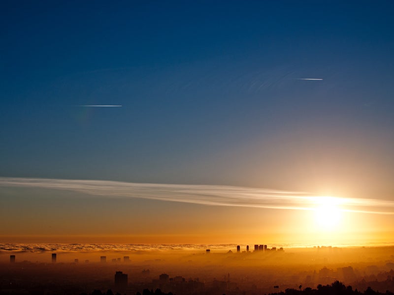 Los Angeles smog and the coastal marine layer meet at sunset.