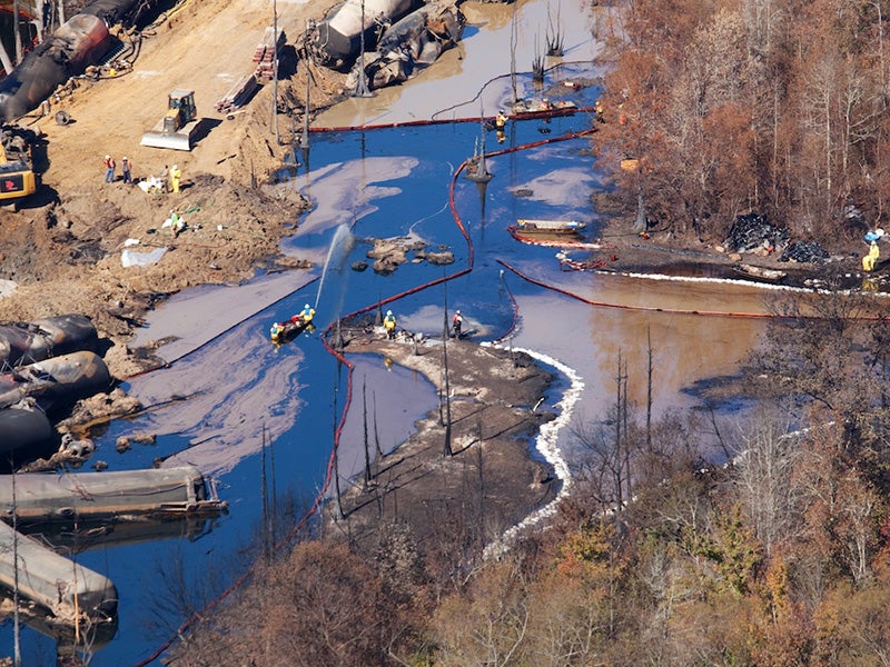 Aerial view of clean up after a Genesee & Wyoming train carrying North Dakota crude derailed near Aliceville, AL, in November 2014, exploding and burning for more than 18 hours. An estimated 748,800 gallons of oil spilled, including into surrounding wetlands. Four months later, oil was still oozing into the water.
(Photo courtesy of John Wathen)