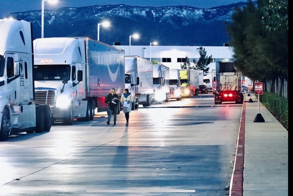 Trucks line up outside the Amazon ONT 2 and 5 facilities in San Bernardino.