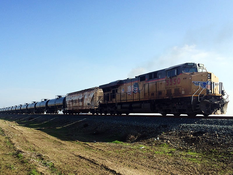 A train transports oil across California&#039;s Central Valley, headed towards the Bakersfield Crude Terminal in Kern County.