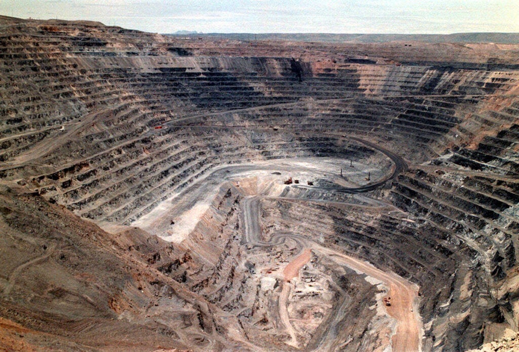 What open-pit gold mining looks like: Barrick Goldstrike Mines' Betze-Post Pit near Carlin, Nev., is one of the largest gold mines in the world. The open pit is so large that it is visible from space. (Adella Harding / Elko Daily Free Press via AP)