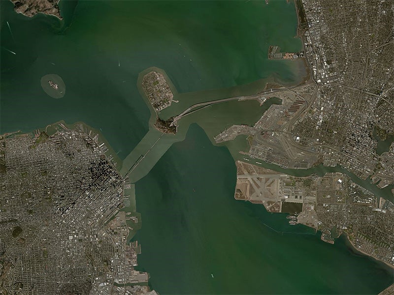 Aerial view of the San Francisco Bay. The coal export terminal would be developed on a piece of land right next to where the eastern end of the San Francisco Bay Bridge (center) touches down in Oakland.