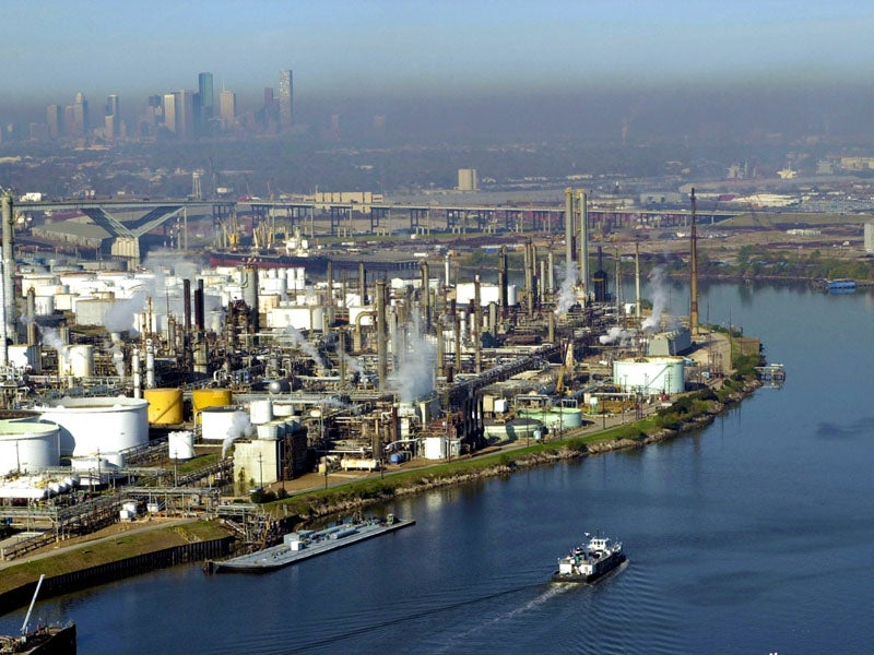A haze of smog covers the Port of Houston. In a $20 million victory for public health, a citizen suit made ExxonMobil pay for violating the Clean Air Act at a facility in this area.