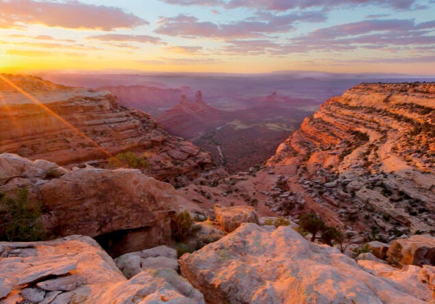 A wide southwest landscape with the sun just setting.