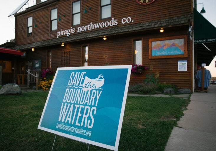 Save the Boundary Waters sign outside of Piragis Northwoods Co., a large outfitter in Ely, Minnesota.