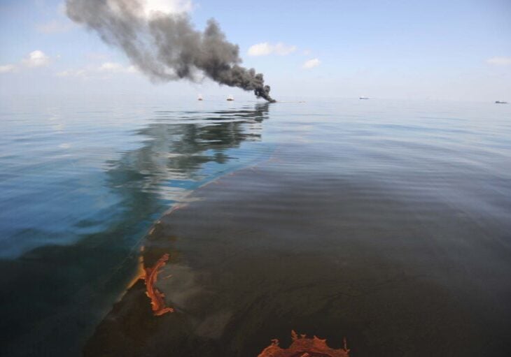 Dark clouds of smoke and fire emerge as oil burns during a controlled fire in the Gulf of Mexico.