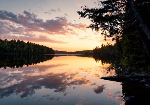 The sun sets over Alder Lake in the Boundary Waters Canoe Area Wilderness in Minnesota.