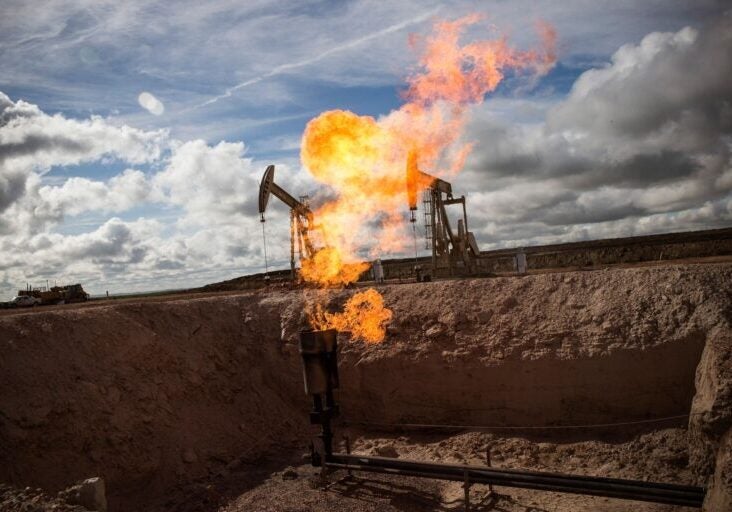 A gas flare is seen at an oil well site on July 26, 2013 outside Williston, North Dakota. (Andrew Burton/Getty Images)