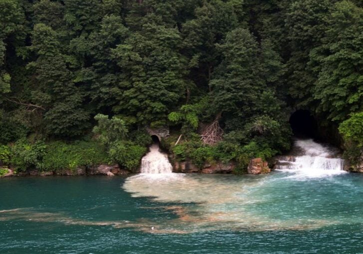 Treated wastewater effluent flows from a pipe into the Niagara River. (Brian Kennedy / Getty Images)