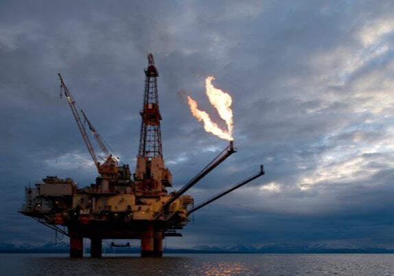 A natural gas flare from an offshore oil drilling rig in Cook Inlet, Alaska.