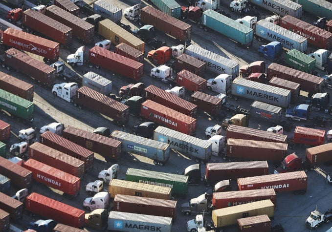 Trucks haul shipping containers at the Port of Los Angeles, the nation's busiest port. Their emissions create diesel death zones along freight lines and freeways throughout the state. Trucks produce the pollution for 40% of California’s unhealthy smog problem.