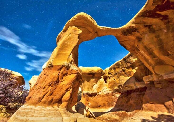 A moonlit arch rises over Grand Staircase-Escalante National Monument.