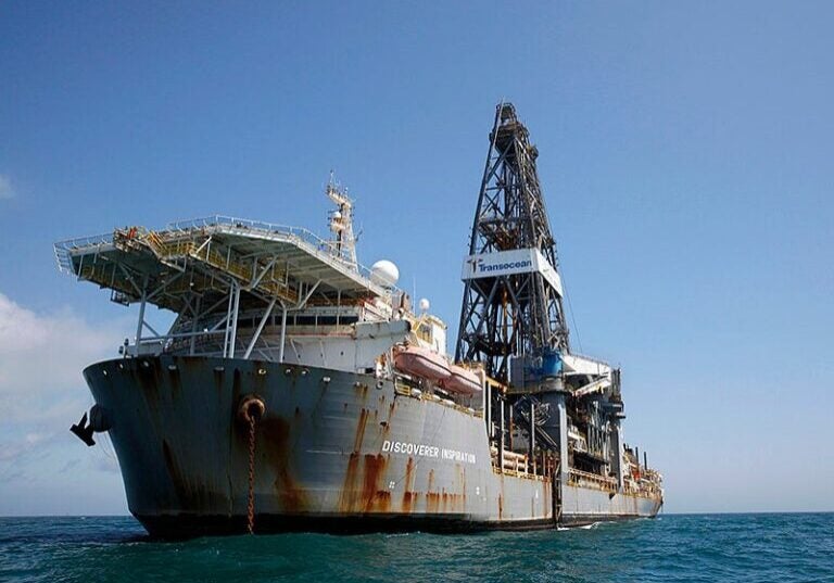 An oil drilling ship sits anchored in the Gulf of Mexico. The Inflation Reduction Act reinstates a sale of 80 million offshore acres in the Gulf of Mexico to oil and gas drilling.