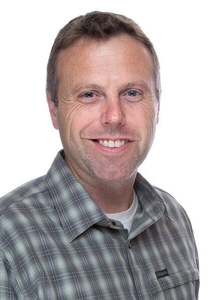 Michael Hiatt, deputy managing attorney at Earthjustice's Rocky Mountain office, is smiling, looking at the camera.
