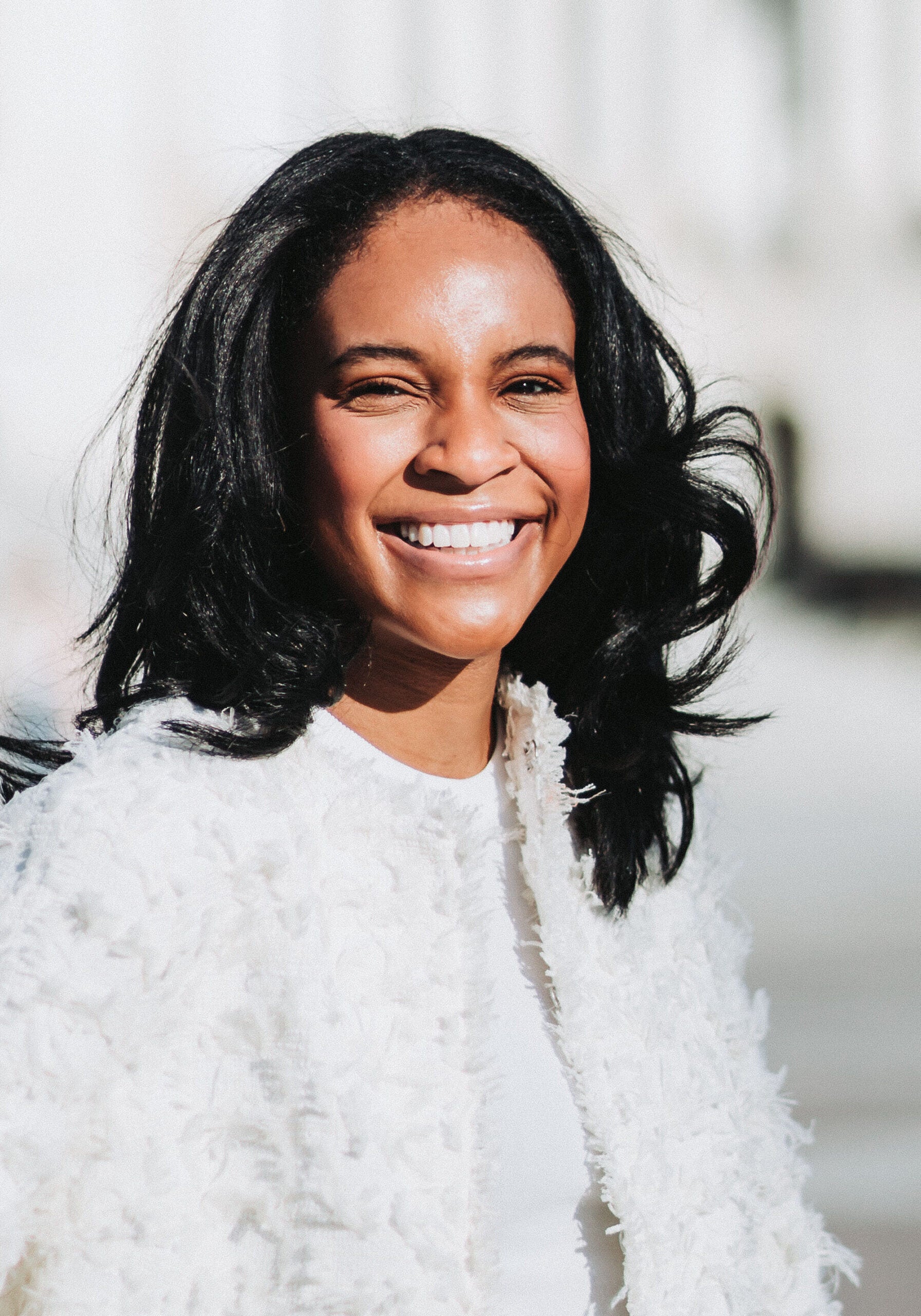Jasmine Jennings-Eller, senior legislative counsel at Earthjustice, is smiling and looking at the camera.