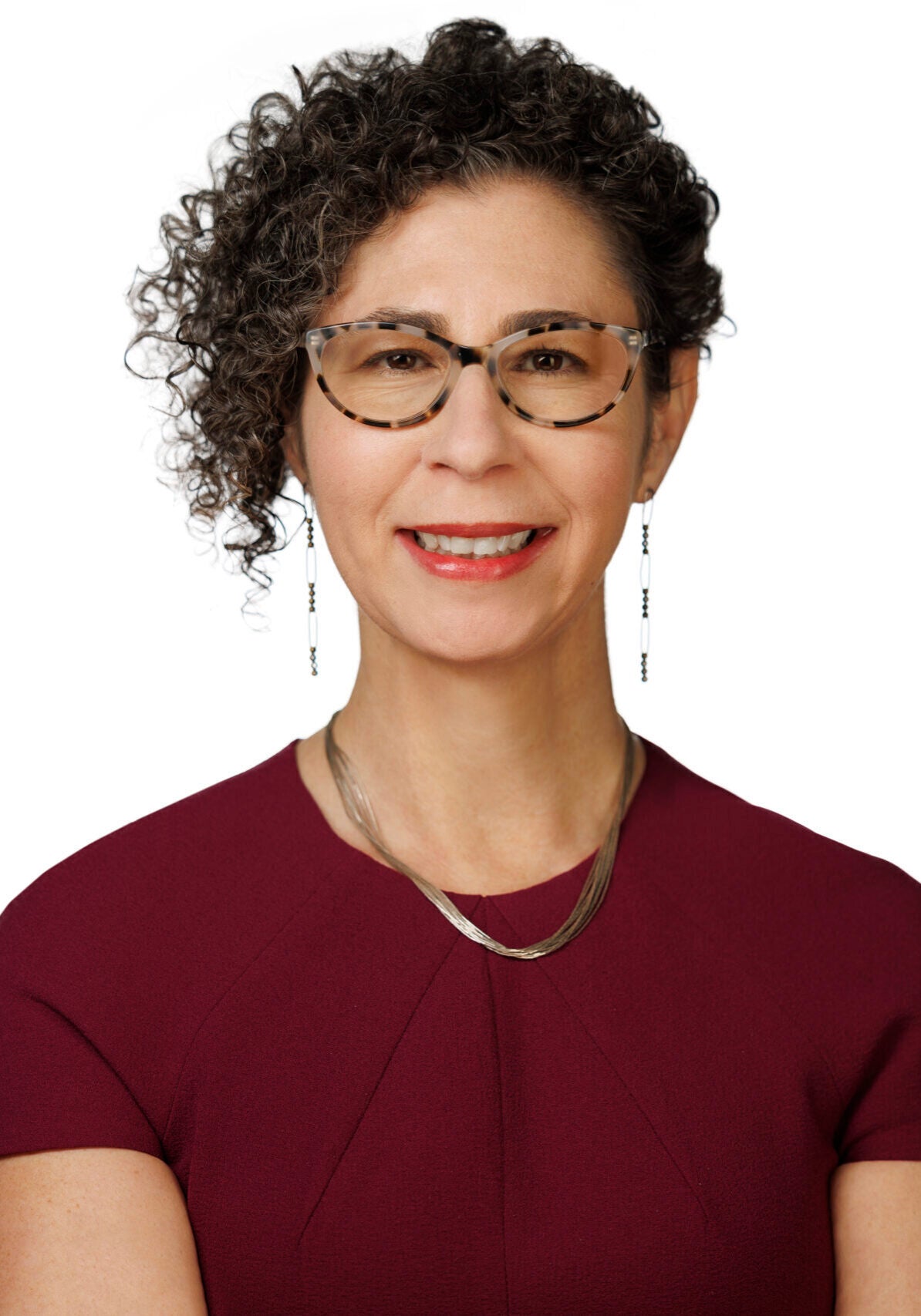 Jen Brock, legislative director of Courts and Administrative law on Earthjustice's Policy and Legislation team, is smiling and looking at the camera.