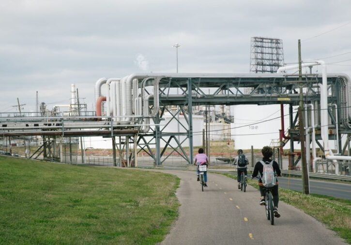 A Louisiana Bucket Brigade bicycle tour in Norco, Louisiana, on Mar. 16, 2022, cycles by oil and gas infrastructure.