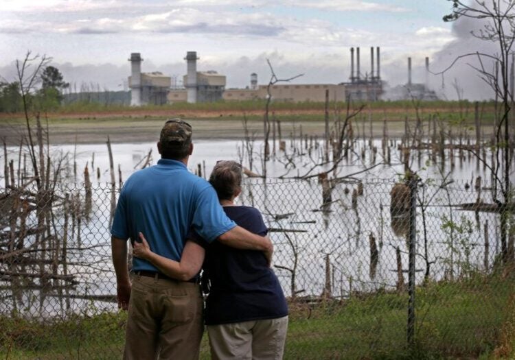 A coal ash pond full of dead trees lies adjacent to Duke Energy's Buck Steam Station in Dukeville, N.C., in 2016.
